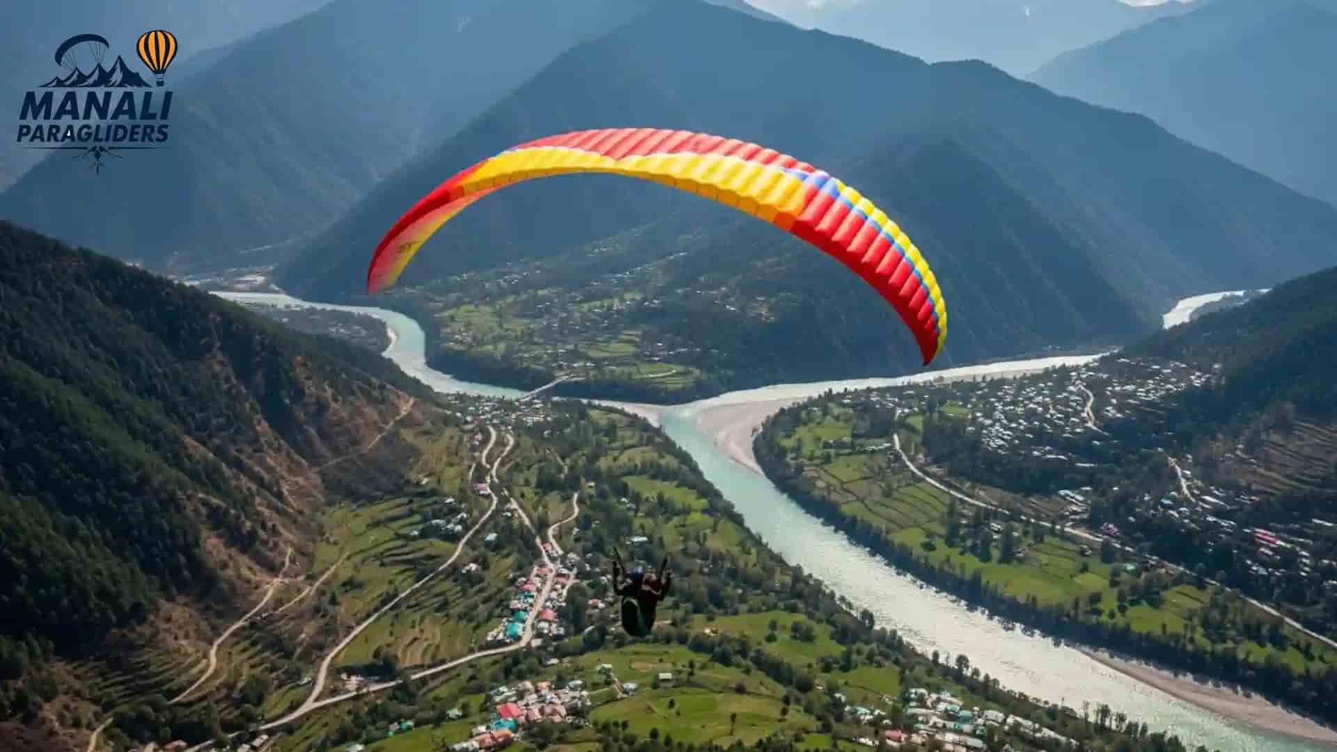 Dobhi Manali paragliding view with mountains, green valley and Beas river under blue sky